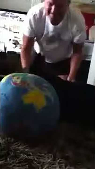 Jack, the Scottie plays with "the World"