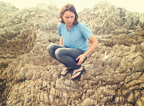 p142 Ben on rocks